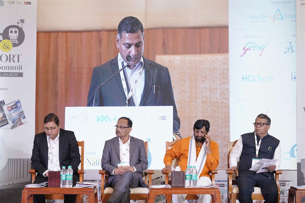 A speaker addressing the summit from the podium